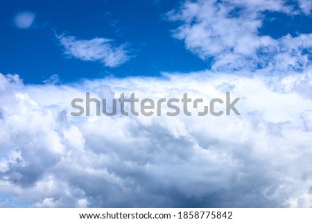 White fluffy cloud on azure blue sky. Rain weather or cyclone formation. Abstract natural photo. Cotton softness concept. Zen or relax cover template.  Cloudy sky overcast ストックフォト © 