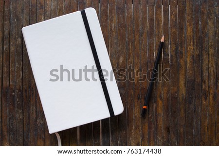 Similar – Image, Stock Photo closed notebook and wooden blue pencil