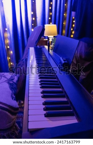 Similar – Image, Stock Photo Hands playing a midi keyboard in a music studio