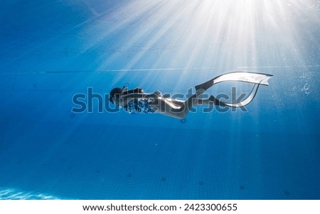 Similar – Image, Stock Photo Woman swimming underwater in sea