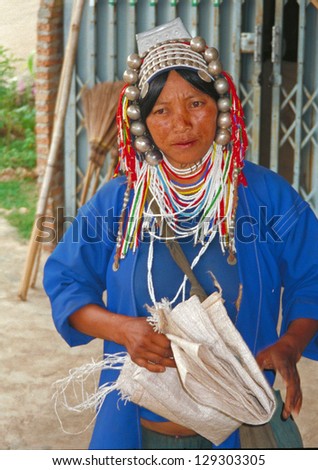 THAILAND - MARCH 22: Akha woman on March 22, 1995, at Thailand. The Akhas are an indigenous hilltribe in Northern Thailand. Their lifestyle is protected as part of the thai cultural heritage.