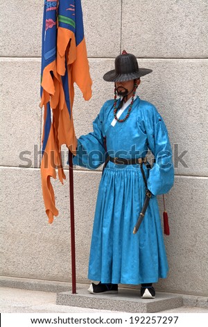 SEOUL, SOUTH KOREA - MAY 11: Royal guard on May 11, 2014, Seoul, South Korea. Guards in medieval clothes had been protected the Gyeongbok Palace for centuries. This palace is a world heritage site.