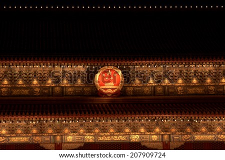 BEIJING, CHINA - JUNE 17: Tienanmen Gate by night with the picture of Chairman Mao on June 17, 2014, Beijing, China. Mao Zedong was the first president of the People\'s Republic of China.