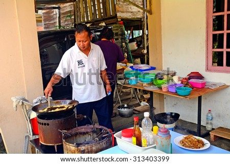 MALAYSIA - MARCH 1 : Fried fish under prepare in a Dayak village on 1 March 2015 in Malaysia, Borneo. Dayaks are the native tribes of Borneo.