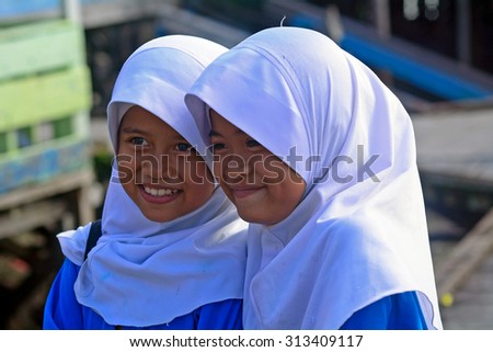 MALAYSIA - MARCH 2 : Muslim schoolgirls in a village on 2 March 2015 in Malaysia, Borneo. Islam has spread out in tribal  Borneo as well.