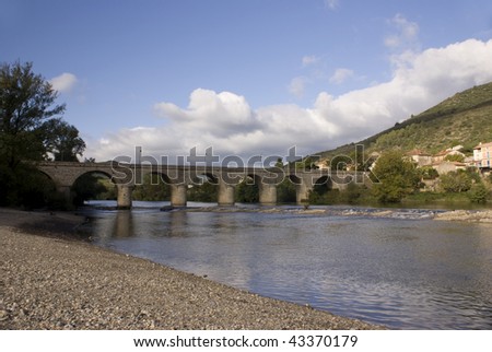 Arched bridge over the river Orb France