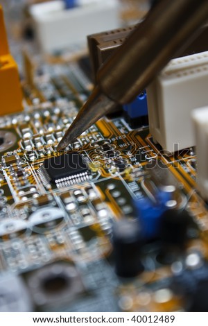 Repair electronic circuit board with soldering iron
