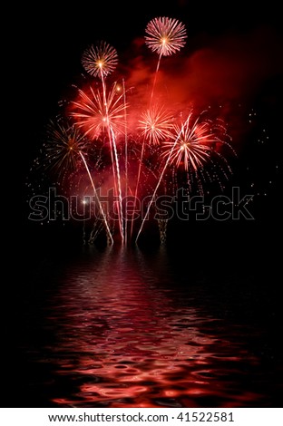 The fireworks show with a reflection on the water