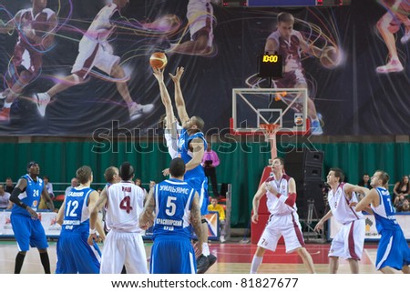 SAMARA, RUSSIA - MAY 11: Players from the BC Krasnye Krylia and BC Enisey teams reach for the tip off ball at the start of their match up on May 11, 2011 in Samara, Russia.
