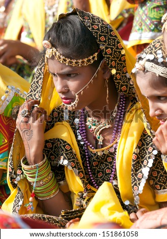 PUSHKAR, INDIA - NOVEMBER 21: An unidentified group of girls in colorful ethnic attire attends at the Pushkar fair on November 21, 2012 in Pushkar, Rajasthan, India.