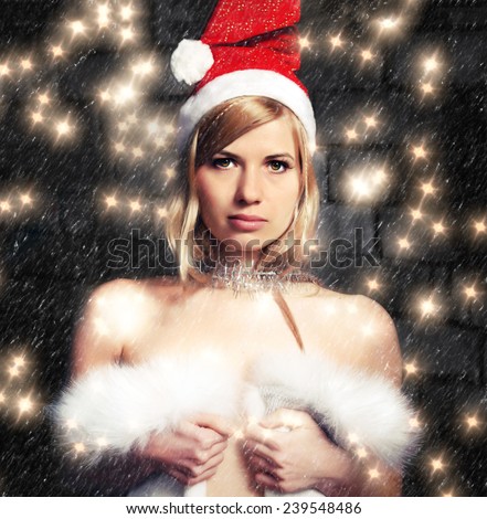 Snow Maiden with bare shoulders on a dark background with lights