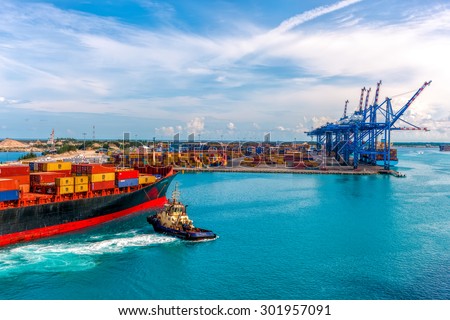 CONTAINER PORT OF FREEPORT GRAND BAHAMAS ISLAND - OCT., 8, 2014: Container ship delivers cargo to the port.