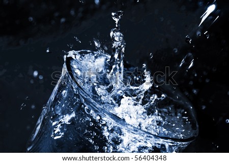 Stream  water being poured into a glass. Splash in a glass.