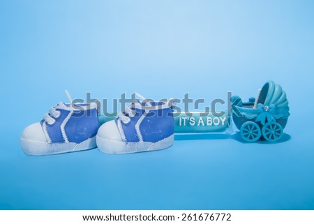 A baby boy birth announcement against a blue background