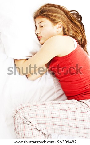 Above view of young beautiful woman sleeping in bed covered