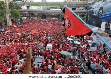 BANGKOK - DECEMBER 19: An estimated 10,000 anti-government red-shirts defy an emergency decree to protest at Ratchaprasong Junction on December 19, 2010 in Bangkok, Thailand.