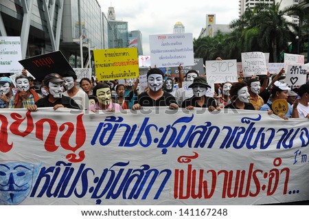 BANGKOK - JUN 2: Anti-government protesters wearing Guy Fawkes masks rally in Bangkok\'s shopping district on Jun 2, 2013 in Bangkok, Thailand. The protesters call for the government to be overthrown.