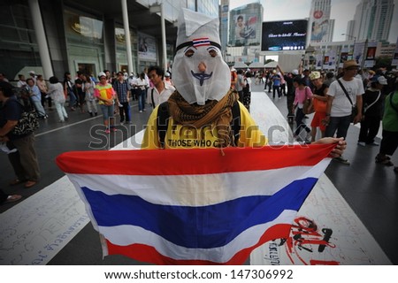 BANGKOK - JULY 21: Protesters hold an anti-government rally in Bangkok's shopping district on July 21, 2013 in Bangkok, Thailand. The protesters call for the government to be overthrown.