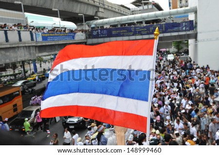 BANGKOK - JUN 16: Anti-government protesters rally in Bangkok\'s shopping district on Jun 16, 2013. The protesters known as the White Masks and V for Thailand call for the government to be overthrown.