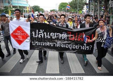 BANGKOK - NOV 11: Unidentified protesters march through the Thai capital to join a large anti-government rally on Nov 11, 2013 in Bangkok, Thailand.