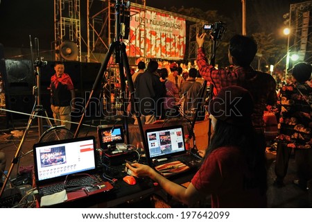 BANGKOK - JAN 29: An unidentified video editor operates an editing system during a large city center red-shirt rally on Jan 29, 2013 in Bangkok, Thailand.