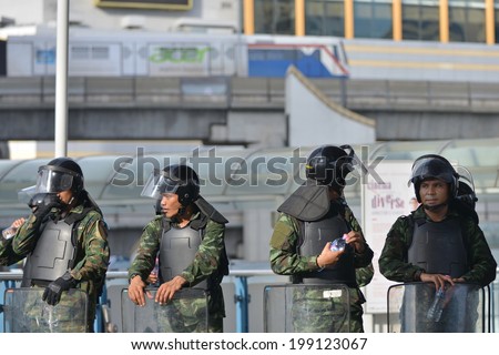 BANGKOK - MAY 31: Thai soldiers in riot gear secure a shopping district in preventing anti-coup protests on May 31, 2014 in Bangkok, Thailand. Thailand is experiencing its 19th military coup.