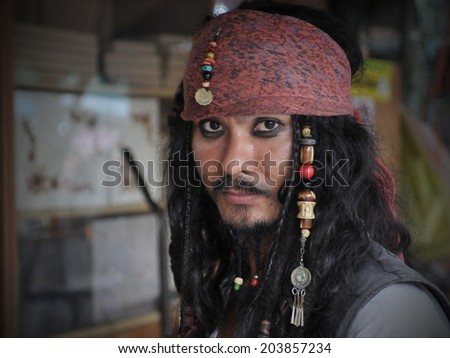 BANGKOK - SEP 11: An unidentified man poses as Jack Sparrow from Pirates of the Caribbean movie franchise at an informal cosplay meet at Chatuchak Weekend Market Sep 11, 2011 in Bangkok, Thailand.