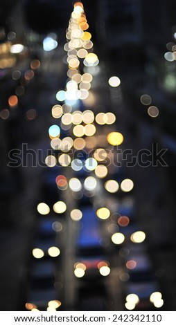 Defocused Lights of Heavy Traffic on a Busy City Road at Night