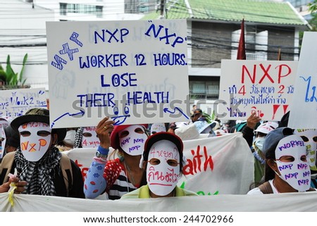 BANGKOK - MARCH 13: Thai NXP workers protest infront of the Royal Netherlands Embassy on March 13, 2013 in Bangkok, Thailand. Union workers gathered in calling for better wages and work conditions.