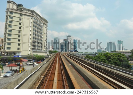 KUALA LUMPUR - MAY 14: View of a RapidKL LRT track running through the city centre on May 14, 2013 in Kuala Lumpur, Malaysia. RapidKL\'s transport network serves approximately 690,000 passengers daily.