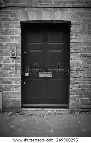 Exterior View of a Front Door of an Old London House in Black and White