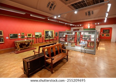 BRISTOL - JAN 11: View of a gallery hall of paintings and artwork on display at Bristol Museum on Jan 11, 2015 in Bristol, UK. Bristol Museum has a large collection of fine art.
