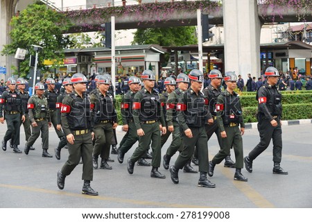 BANGKOK - MAY 30: Military police deploy on a city centre street following a military coup on May 30, 2014 in Bangkok, Thailand. The Thai capital is under martial law after Thailand\'s 19th coup.
