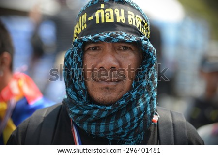 BANGKOK - MAR 28: An anti-government protester takes part in a rally at government buildings on Mar 28, 2014 in Bangkok, Thailand. The protest movement calls for political reform before elections.