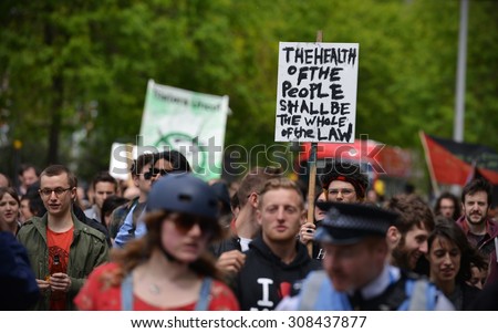 LONDON - MAY 30: Protesters rally against public sector spending cuts following the re-election of the Conservative party on May 30, 2015 in London, UK. The government plans severe austerity measures.