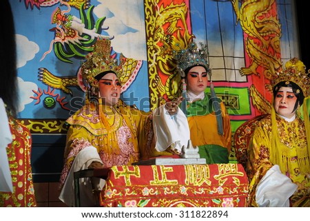 BANGKOK - FEB 4: Actors appear in a public showing of Chinese opera on a street in Chinatown district on Feb 4, 2012 in Bangok, Thailand. Chinese opera originated in the Tang dynasty circa 720 AD.