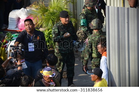 BANGKOK - JAN 17: Army officers secure a bomb attack site during an anti government rally on Jan 17,  2014 in Bangkok, Thailand. The bomb killed one protester and injured dozens.