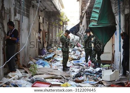 BANGKOK - JAN 17: Soldiers search derelict buildings following a bomb attack on anti government rally on Jan 17,  2014 in Bangkok, Thailand. One protester died in the bombing and dozens were injured.