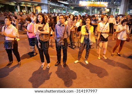 BANGKOK - JAN 21: Protesters stand to sing the royal anthem during an anti government rally on Jan 21, 2014 in Bangkok, Thailand. Nationalist protesters call for the government to be overthrown.