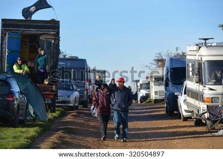 STONEHENGE - SEP 23: Travellers camp out at Stonehenge during celebrations marking autumn equinox on Sep 23, 2015 in Stonehenge, UK. The world famous landmark is thought to date back to 2600 BC.