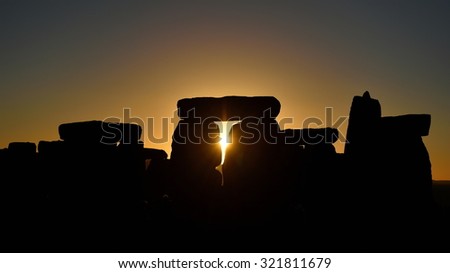 View of the Autumn Equinox Sunrise at against the Silhouette of the Standing Stones at Stonehenge in England