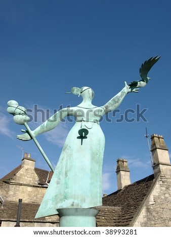Bronze Sculpture of a Woman Releasing a Dove