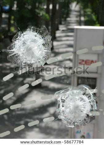 BANGKOK - MAY 23: Window of Zen Central World shopping mall damaged by gunfire and the scene of multiple shootings during the anti government \'Red Shirt\' protest May 23, 2010 in Bangkok, Thailand.