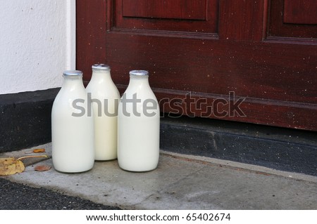 Bottles of Milk on a Doorstep