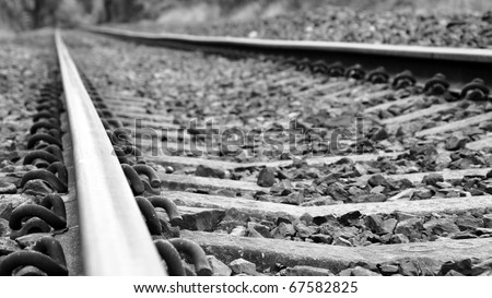 Low Angle View of Railway Tracks in Black and White with Shallow Depth of Field