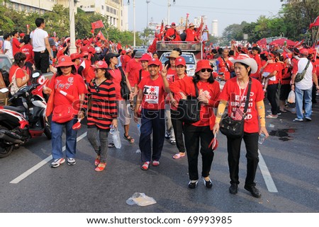 BANGKOK - JANUARY 23: Anti-government red-shirts arrive at a rally at Democracy Monument on January 23, 2011 in Bangkok, Thailand. The red-shirts are calling for political change and fresh elections.
