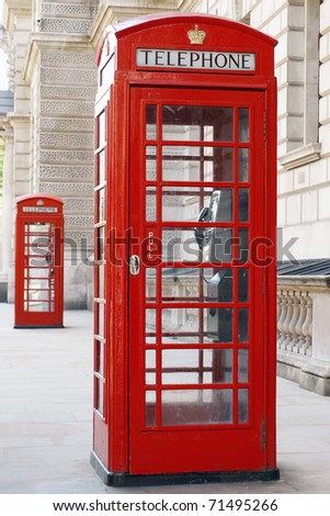 Traditional Old Style British Red Phone Boxes on a London Street