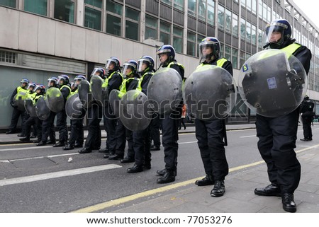LONDON - MARCH 26: Riot police block a road entrance during a 250,000 strong anti public sector spending cuts rally organised by the TUC March 26, 2011 in London, UK.