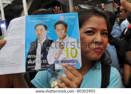 BANGKOK - JUNE 23: An unidentified Democrat Party supporter attends an election campaign rally at Ratchaprasong in the city centre June 23, 2011 in Bangkok, Thailand. Thais go to the polls on July 3.