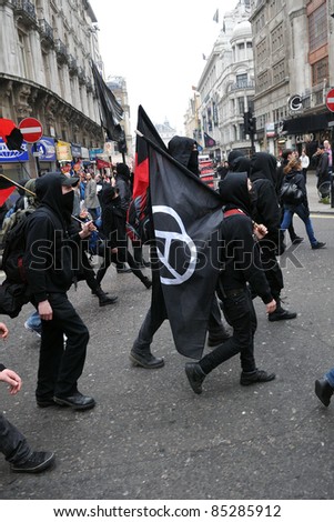LONDON - MARCH 26: A breakaway group of protesters march through the streets of the British capital during a large anti-cuts rally March 26, 2011 in London, UK.